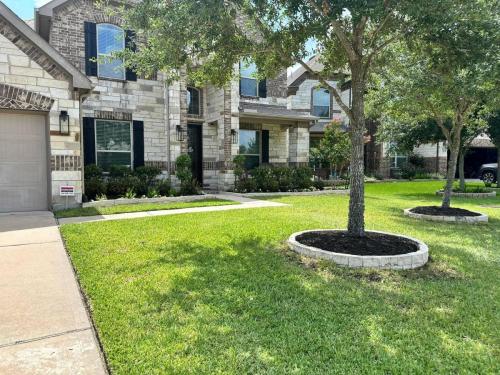 Landscaping in Magnolia Creek Subdivision, League City. Landscaping, plants, flowers, stone.