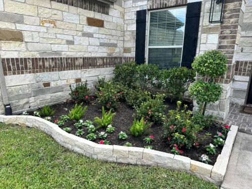 Landscaping in Magnolia Creek Subdivision, League City. Stone border