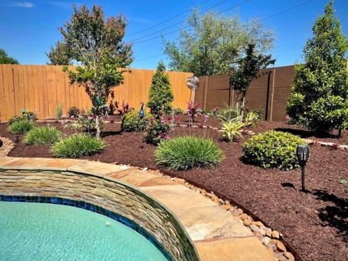 Landscaping in West Ranch, Subdivision, Friendswood. Behind pool landscape. 