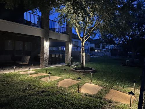 Landscape lighting, pool lighting, tree uplighting, walkway lighting