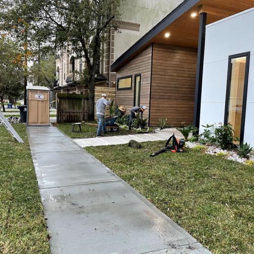 Yard Works men installing new sidewalk in League City