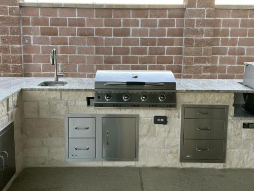 Outdoor kitchen, grilling, backyard kitchen, custom patio. Westwood Subdivision, League City.