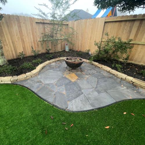new turf and firepit in backyard of house in League City